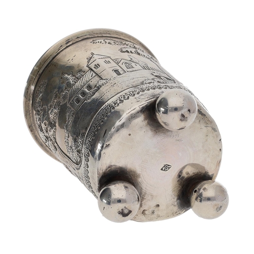 462 - 19th century continental white metal beaker, worked in relief with a building and church among trees... 