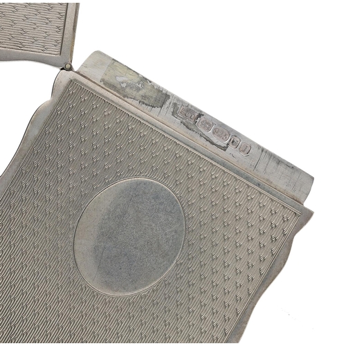 494 - PJD Silver Ltd silver card case, having a shaped edge and engine turned decoration to the front and ... 