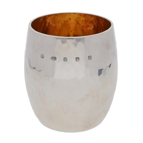 499 - Decorative planished 958 silver beaker, of barrel form with gilt interior, maker Francis Howard Ltd,... 