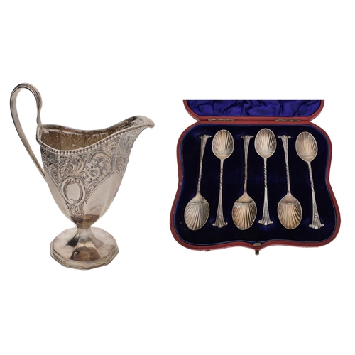 467 - Victorian silver helmet shaped cream jug, with ornate foliate repoussé decoration, Chester 1896; tog... 