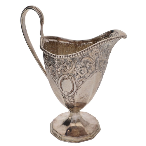 467 - Victorian silver helmet shaped cream jug, with ornate foliate repoussé decoration, Chester 1896; tog... 