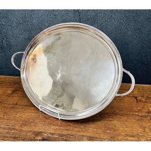 478 - Silver plated oval twin handled tray, with gadroon border, engraved to the centre with a bee among f... 