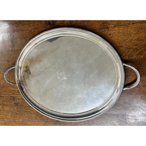 478 - Silver plated oval twin handled tray, with gadroon border, engraved to the centre with a bee among f... 