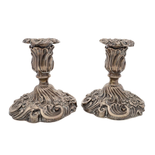 476 - Pair of Victorian ornate silver dwarf candlesticks, with C-scroll and foliate decoration, loaded sha... 
