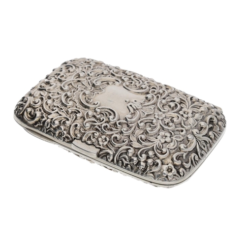 575 - Victorian repoussé silver cigarette case, the cover densely scroll decorated and the interior gilt, ... 