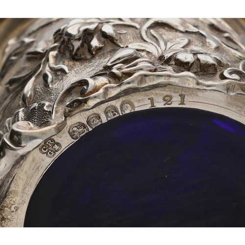 582 - Good heavy cast silver mustard pot with hinged cover, having a leaf capped handle and raised on shel... 