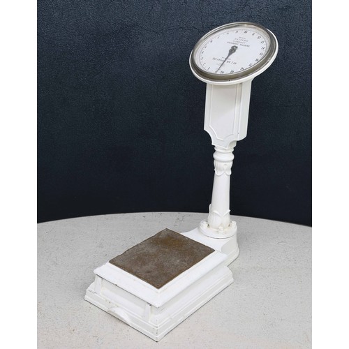634 - Salters 'Compact' white painted metal weighing machine, number 216, with a circular dial... 