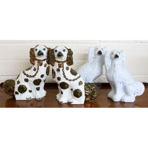 124 - Pair of Staffordshire models of spaniels, with copper lustre markings, 12.5