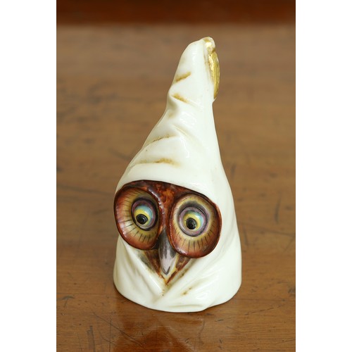 122 - Royal Worcester Owl candle extinguisher, facial features highlighted in colours, puce mark and date ... 