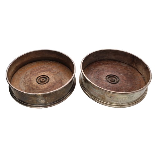 79 - Pair of modern silver coasters, with turned wooden bases, maker M.C. Hersey & Son, London 1986, ... 