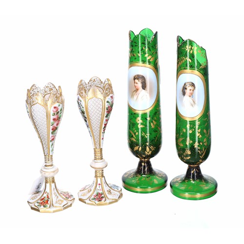 126 - Pair of late 19th century Bohemian overlay glass vases, painted with panels of flowers, 9