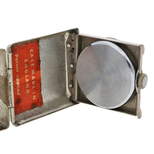 396 - Art Deco metal cased folding travel purse watch, silvered dial with luminous Arabic numerals and out... 