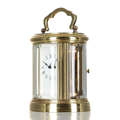 1034 - French miniature oval carriage clock timepiece, the enamel dial with Roman numerals, platform lever ... 
