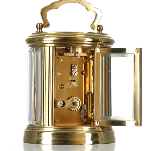 1034 - French miniature oval carriage clock timepiece, the enamel dial with Roman numerals, platform lever ... 