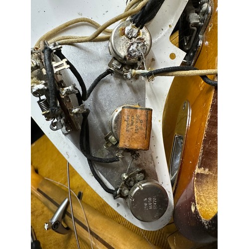 6 - 1959 Fender Stratocaster electric guitar, made in USA; Body: three-tone sunburst finished alder, som... 