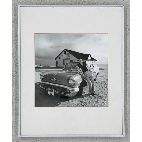 28 - Gered Mankowitz (born 1946) - Chris Spedding on Camber Sands, 1975, printed 1981, bromide print, fra... 
