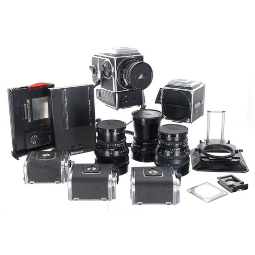 Gered Mankowitz – Studio and location-used Hasselblad camera outfit, 1981–2014, comprising a Hasselblad 500 C/M camera body, Hasselblad 555ELD camera body, 50mm, 80mm, 120mm and 150mm Hasselblad lenses, Hasselblad HMi 100 Polaroid back, Polaroid Hasselblad 100 back, four Hasselblad film backs, together with other accessories, all housed within a heavy-duty Peli 1600 protective case