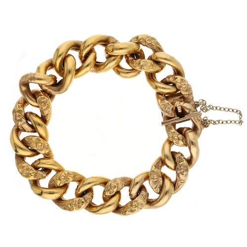19 - Victorian gilded metal curb link bracelet with repoussé foliate links, 24gm, width 14mm with safety ... 
