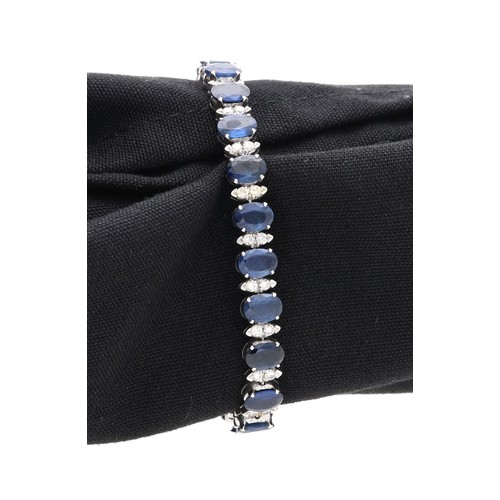 26 - Good modern 18ct white gold sapphire and diamond bracelet, consisting of twenty-three oval sapphires... 