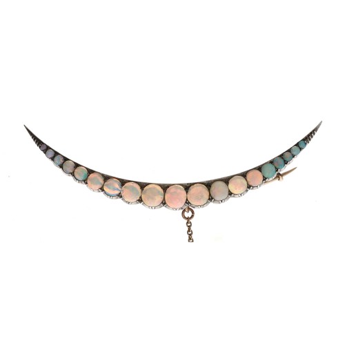 27 - Attractive antique yellow metal opal crescent design brooch, set with nineteen graduated cabouchon o... 