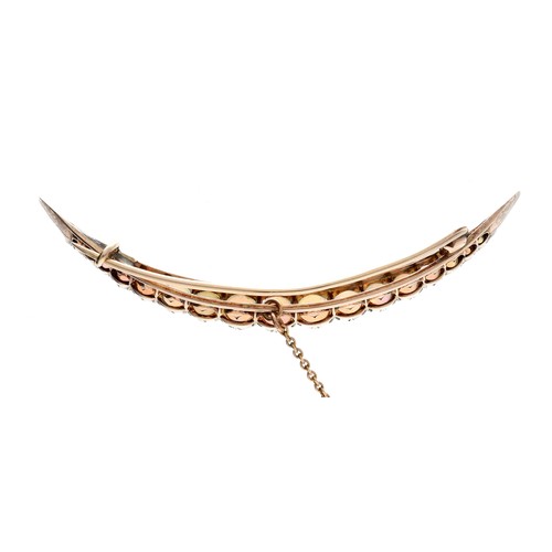 27 - Attractive antique yellow metal opal crescent design brooch, set with nineteen graduated cabouchon o... 