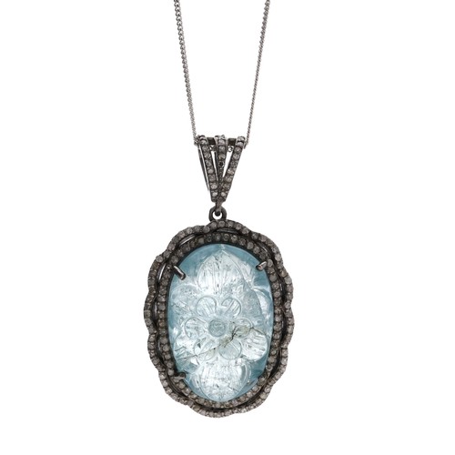 51 - Attractive silver pendant on a slender chain, set with an oval carved aquamarine in a diamond border... 