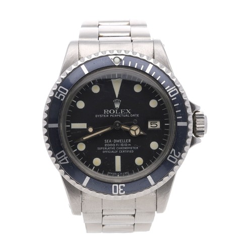 Rolex Oyster Perpetual Date Sea-Dweller 'Great White' stainless steel gentleman's wristwatch, reference no. 1665, serial no. 6177xxx, circa 1979, black dial, rotating bezel with black insert, cal. 1570 26 jewel movement, signed case stamped 1665, Oyster 93150 bracelet with fliplock clasp with extension and 585 end links, 40mm bezel (movement requires repair) (ref: 411)