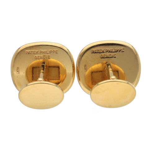 90 - Pair of Patek Philippe Ellipse 18ct yellow gold cufflinks, with blued steel centres, 27.7gm, signed,... 