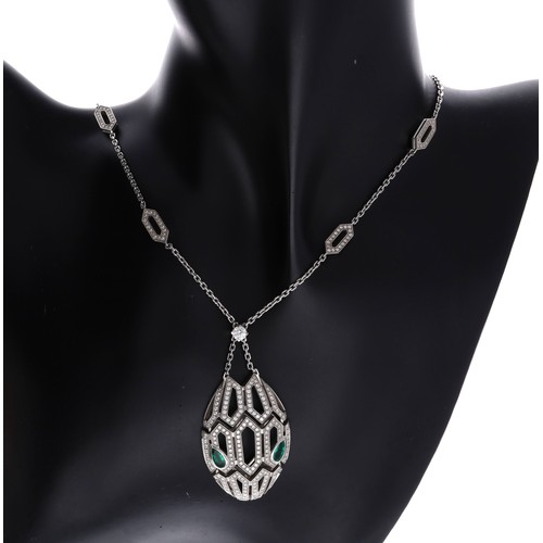 Fine Bulgari Seduttori 18ct white gold diamond and emerald pendant and necklace, T62PM2, the emeralds 0.60ct in total, the diamonds 2.63ct, the pendant 27mm wide. the necklace 17" long, 30.1gm (303)