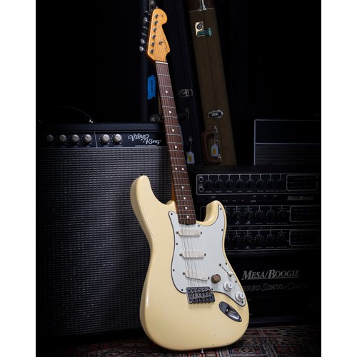 Johnny Marr (The Smiths, The The, The Pretenders) - stage used 1988 Fender American Vintage 1962 Reissue Stratocaster electric guitar, made in USA, ser. no. V034381; Body: Olympic white finish, lacquer checking, scuffs and other general play marks; Neck: maple, signed by Johnny Marr to the back of the head, a few dings; Fretboard: rosewood; Frets: good; Electrics: working, upgraded EMG pickups; Hardware: upgraded graphite bridge block, replacement saddles, replacement control knobs, missing trem arm; Case: later hard case; Overall condition: good