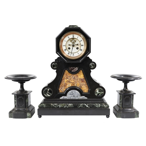 Late 19th century French black slate and marble mantel clock garniture, the 5" white roman numeral dial with visible Brocot escapement, the two train movement with GR monogram, no. 1542 striking the half hours and hours on a bell, the case with an octagonal dial surround over a scroll marble inset panel and rectangular stepped base, 20" high; together with a pair of matching urns, 9" high (with pendulum, the back movement cover lacking the glass)