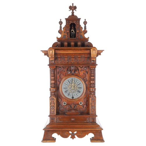 Rare late 19th century German Black Forest Rooster (Hahnen-Uhr) automaton walnut mantel clock by Emilian Wehrle of Furtwangen, circa 1885, 5" dial with Roman numerals and outer minute track, ornate gilt engraved hands, three train thirty hour brass plate movement with rooster sound box mechanism, hour strike and outside countwheel with the automaton calling rooster to the open arch aperture, a single hammer sounding on a gong fitted to the inside of the rear case panel, within a neo-classical styled case with applied carved mouldings, fretwork side doors and upon bracket feet, 29" high, 12.5" wide, depth 8.5" (with pendulum and key)  