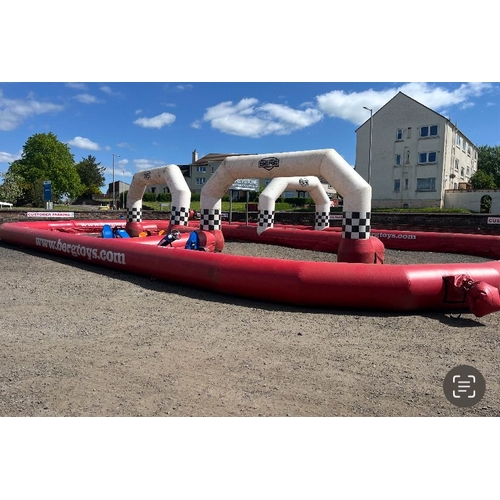 135 - Inflatable go cart track with 4 kids and 5 adult pedal carts