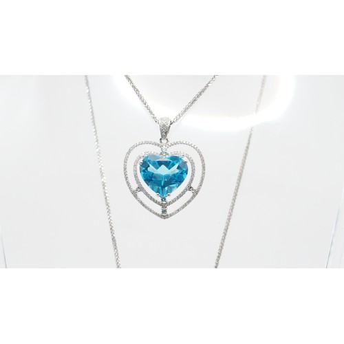 82 - 7.78g 18ct White Gold Diamond And Blue Gemstone Pendant