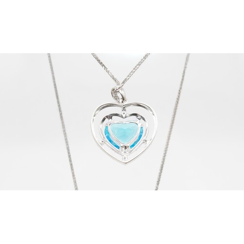 82 - 7.78g 18ct White Gold Diamond And Blue Gemstone Pendant