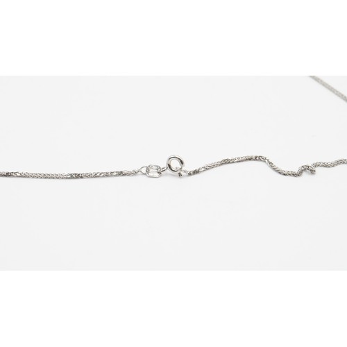 82 - 7.78g 18ct White Gold Diamond And Blue Gemstone Pendant