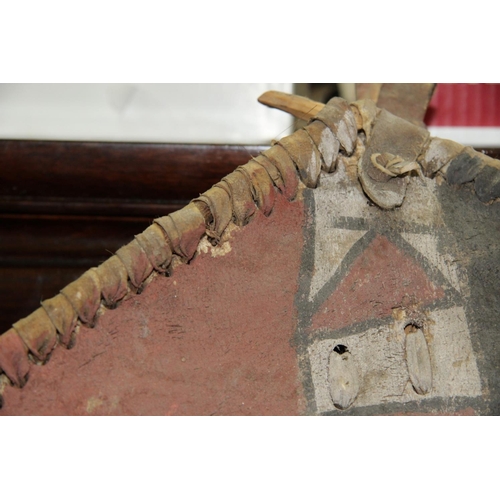 2000 - African: a Maasai Kenya hide shield, with painted decoration, approx 91cm high.