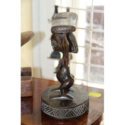 2011 - African: two wooden carved head rests, largest 24cm wide.