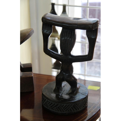 2011 - African: two wooden carved head rests, largest 24cm wide.