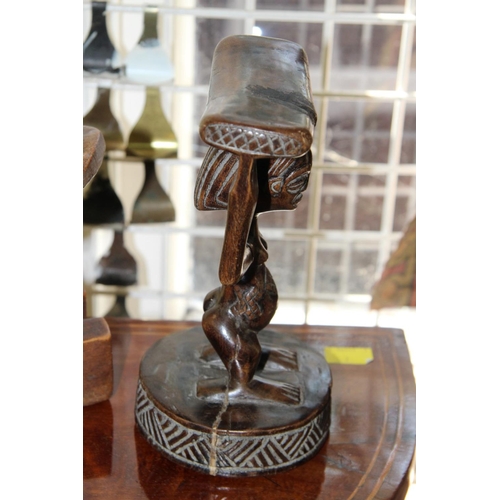 2011 - African: two wooden carved head rests, largest 24cm wide.