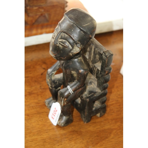 2013 - African: a Nigerian carved seated figure.