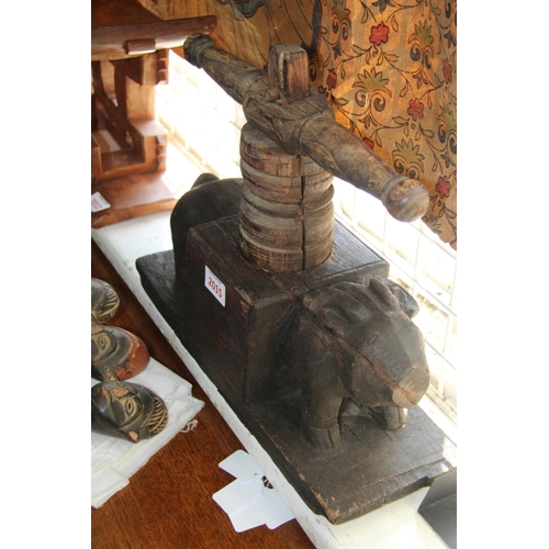 2015 - A Southern Indian carved wood press, of animal form.