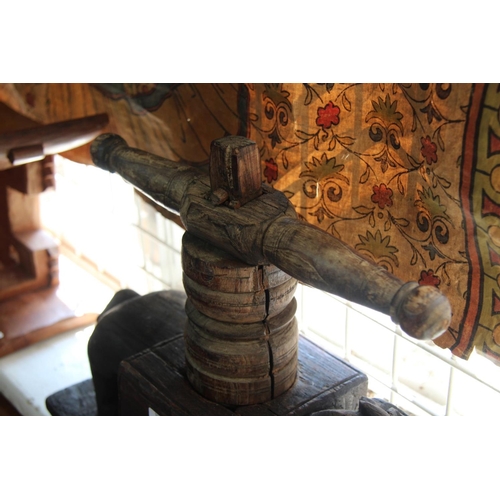 2015 - A Southern Indian carved wood press, of animal form.