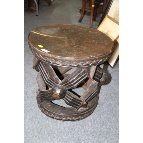 2017 - African: a wooden Cameroon Bamileke stool carved with the spider motif, 41cm diameter.