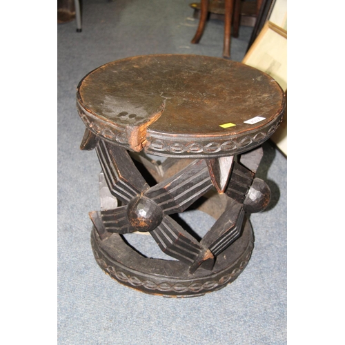 2017 - African: a wooden Cameroon Bamileke stool carved with the spider motif, 41cm diameter.