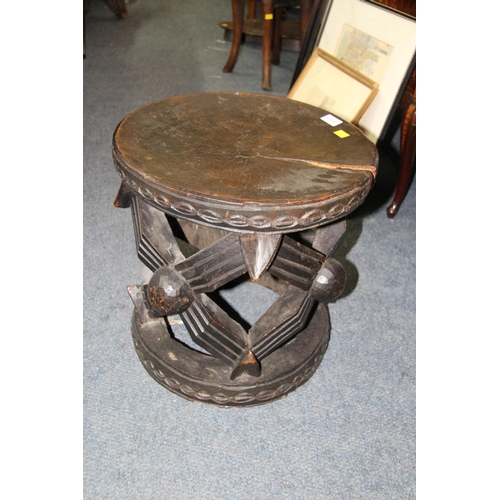 2017 - African: a wooden Cameroon Bamileke stool carved with the spider motif, 41cm diameter.