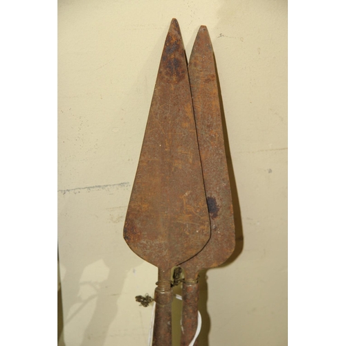 2021 - African: two short spears, having turned wood shafts ending in a ball finial, approx 99cm long.