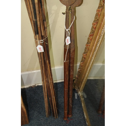 2021 - African: two short spears, having turned wood shafts ending in a ball finial, approx 99cm long.