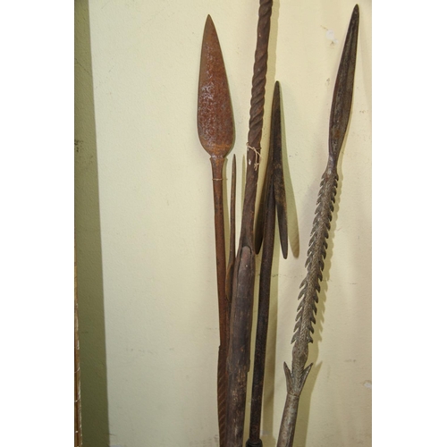 2022 - African: five old spears with shaped heads, some with barbs and wide metal strips wrapped to ends, v... 