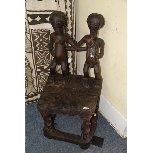 2028 - African: a Chokwe chair, with twin figure back and front supports.